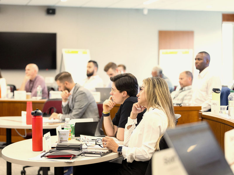 Professionals listening attentively in a seminar room